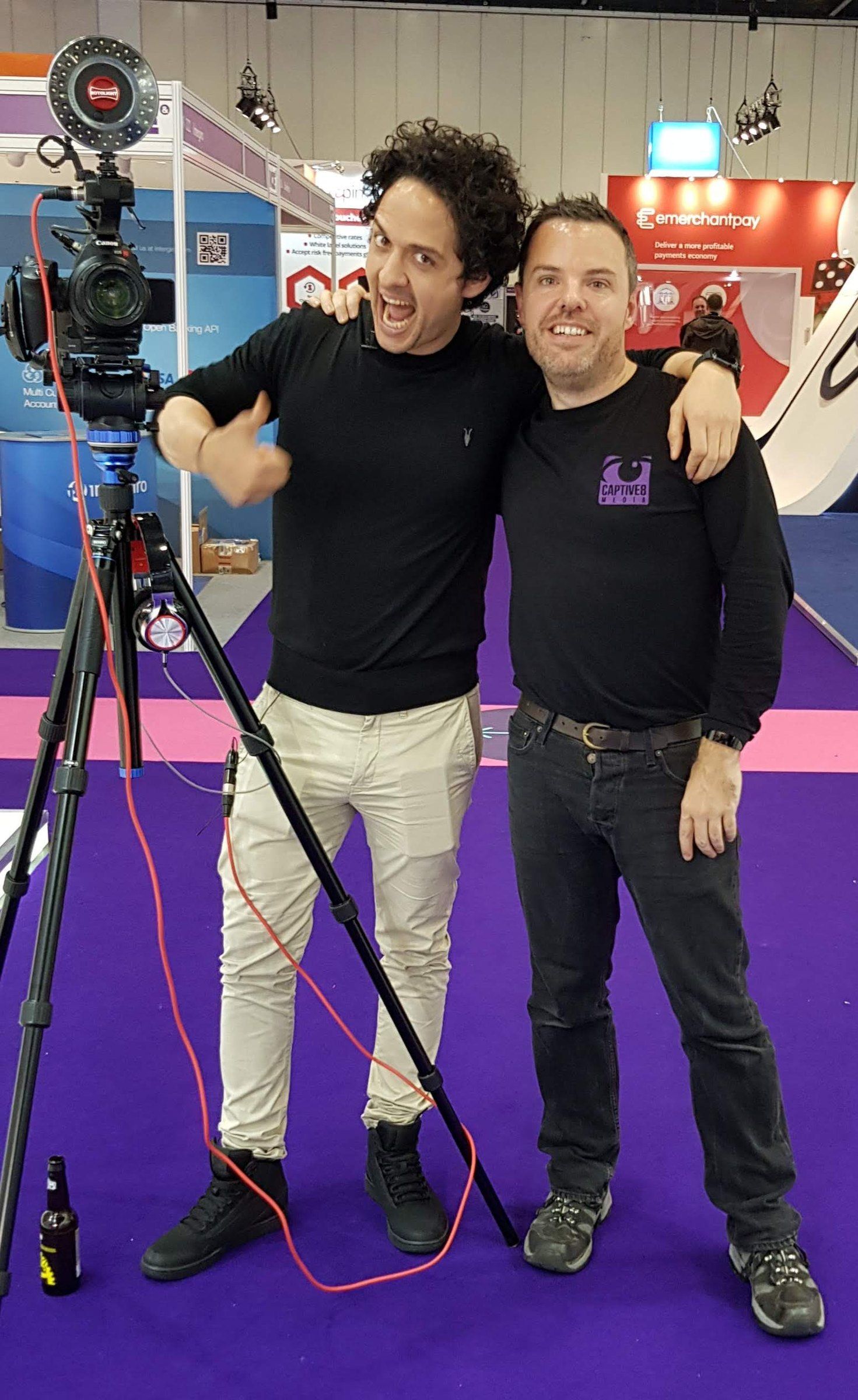 Two of the Captive8 crew with their camera on a show floor