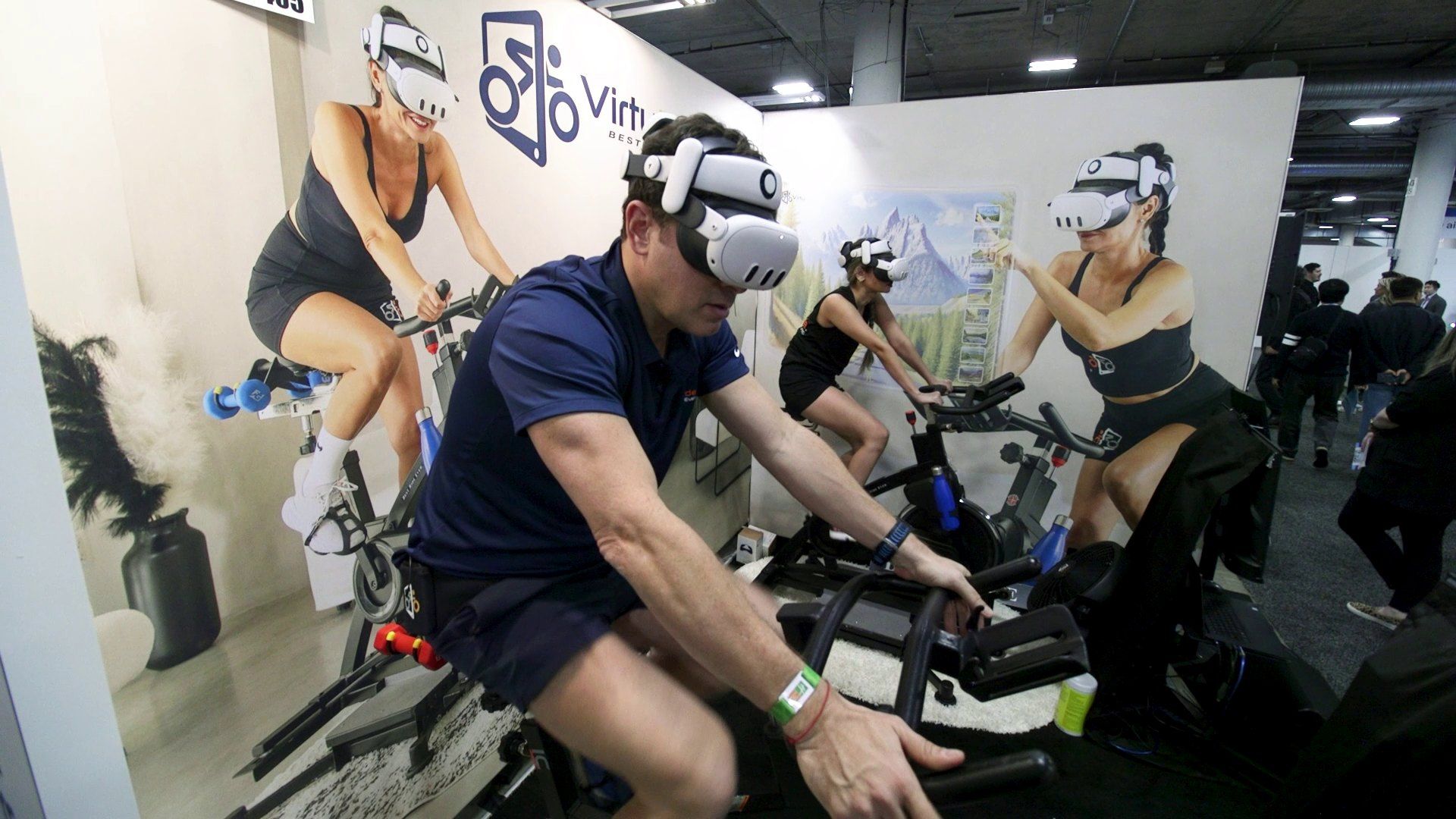 A visitor trying a virtual-reality exercise bike demonstration at CES
