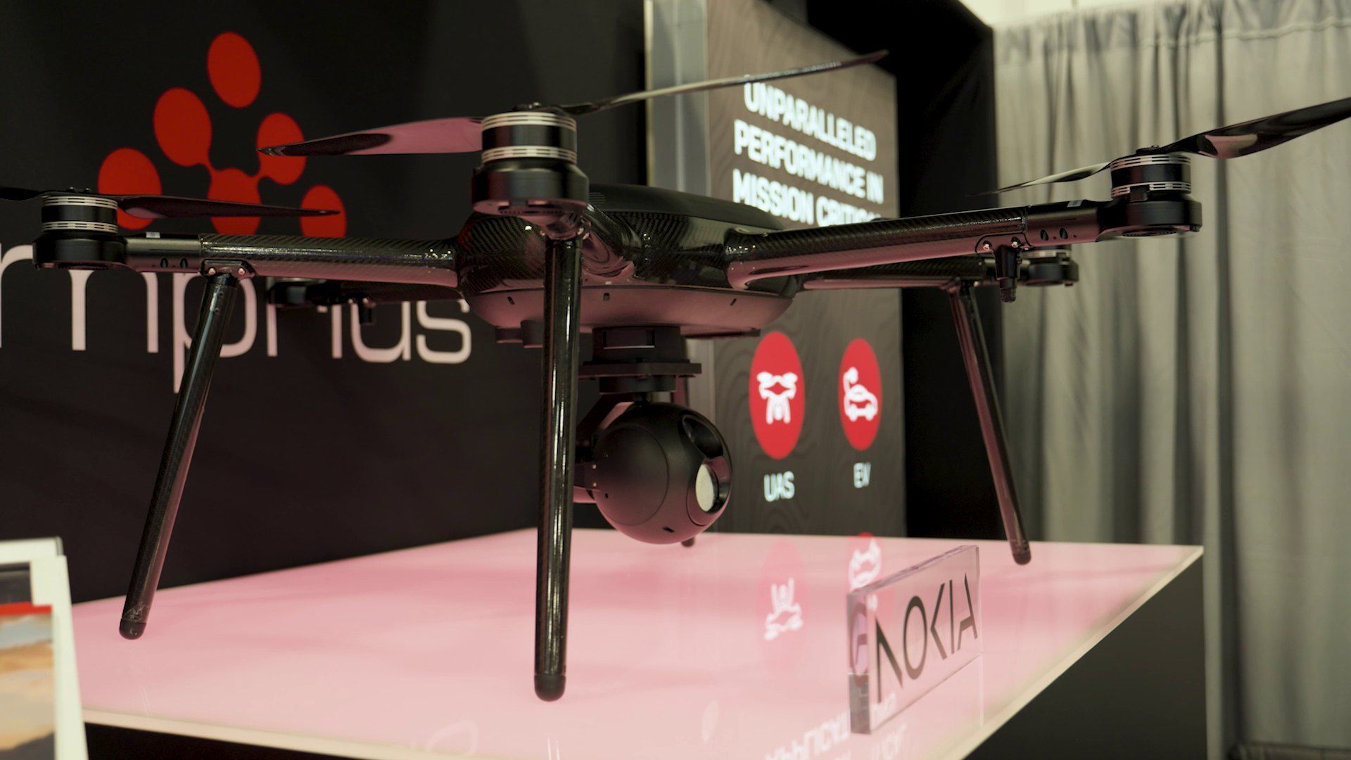A drone on display at a product launch on an exhibition stand