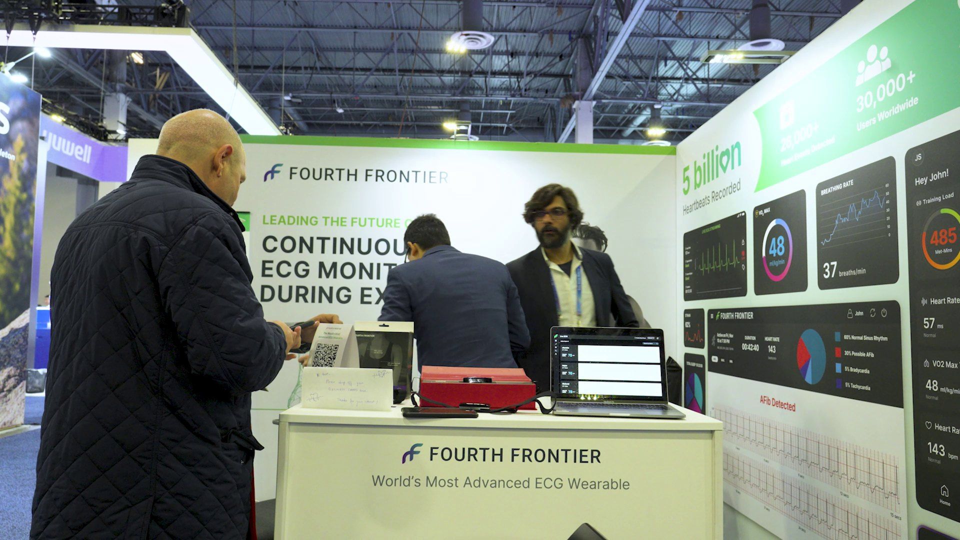 The Fourth Frontier team talking with a visitor on their stand at CES